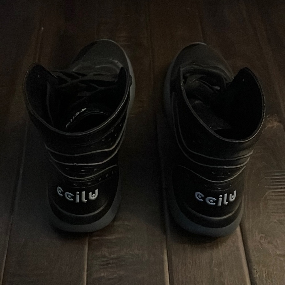 Black high top sneaker boots